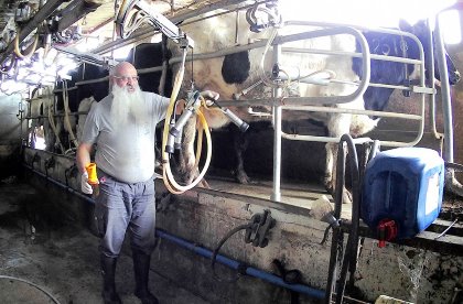 Jonathan Amir milking his cows in Israel. Photo: Chris McCullough Jonathan Amir milking his cows in Israel. Photo: Chris McCullough